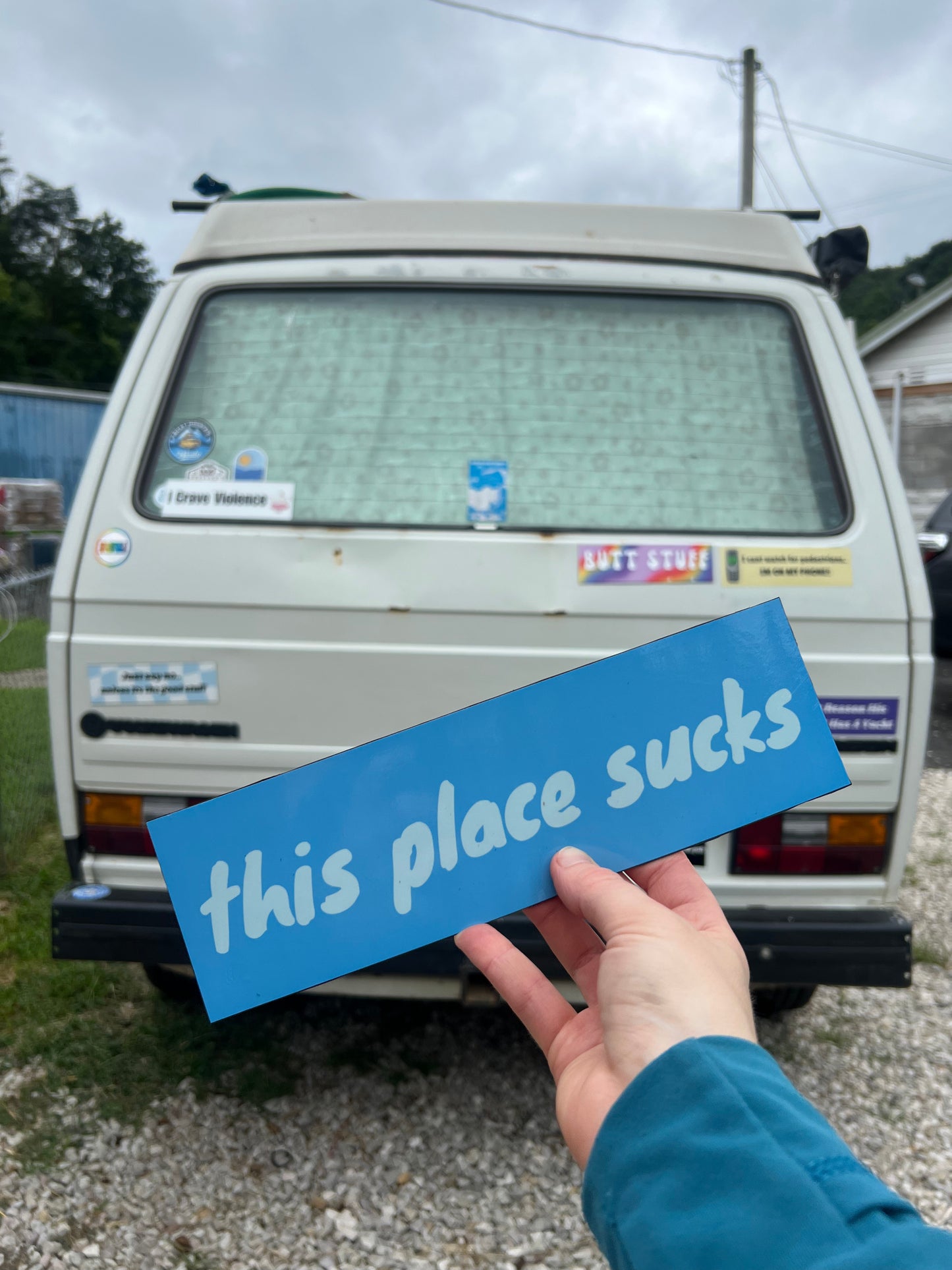This Place Sucks Sticker